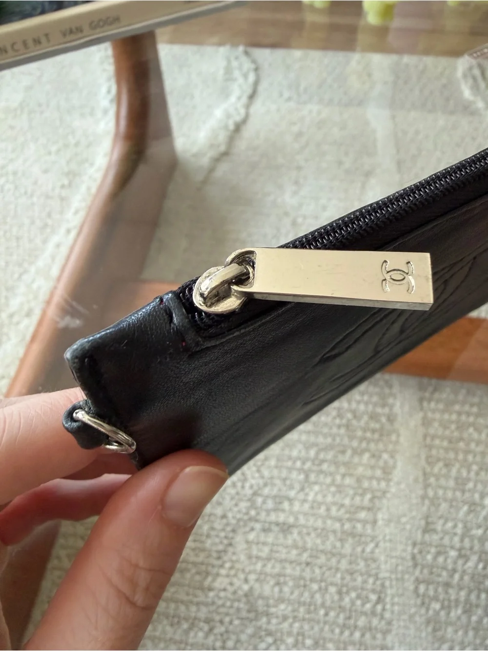 CHANEL CC Black Leather Zip Wallet with Branded Silver Pull.
